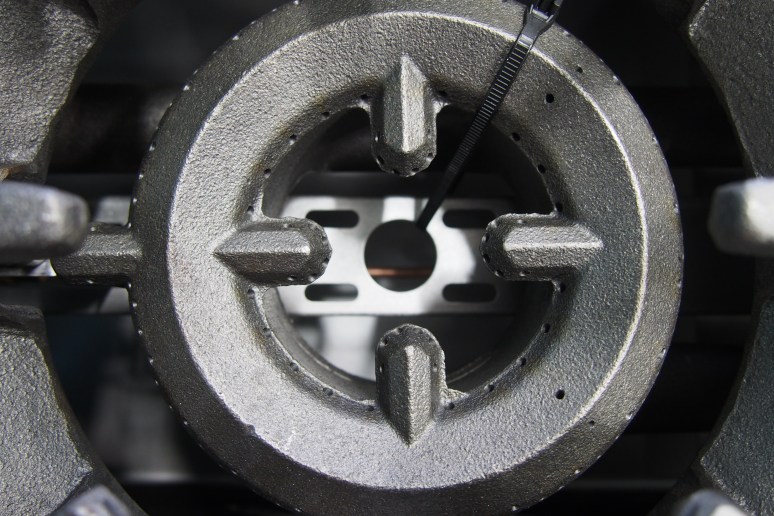 an iron ring with several perforations where gas would seep out