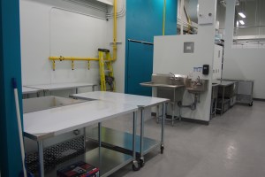 Prep kitchen with stainless steel tables and sinks