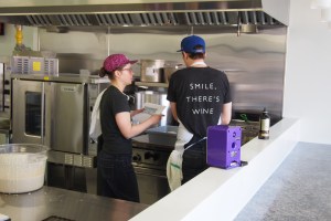 staff in front of deep fryer