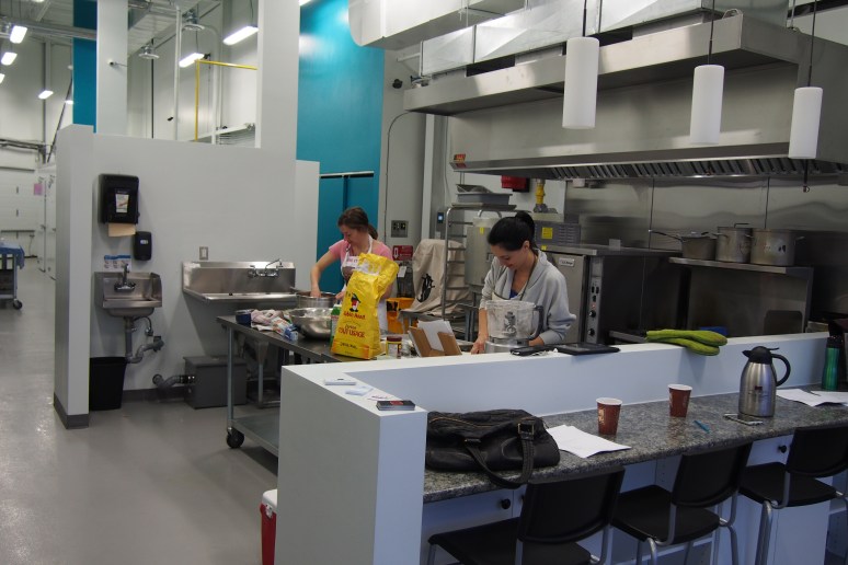 two women working in a commercial kitchen
