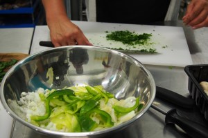 Finely chopping the parsley at the Cauldron Food School.