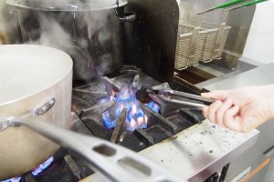 Charring to a crisp poblano peppers