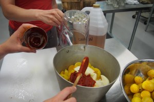 Preparing the pot for blending and reducing the bbq sauce.