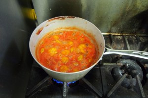 Reducing the plum and kolsch beer bbq sauce.