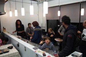 Vendors and patrons talking and eating.